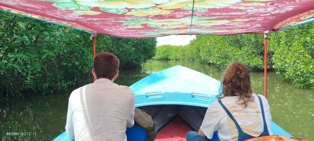 Traditional boat trip through calm mangrove lagoons near Trincomalee, Sri Lanka
